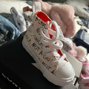 Converse Chuck Hightop Untitled
Toddler Sneakers 4C. Never worn
